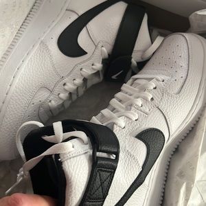 New white with black Nike high Air Force one’s size 7 kids/men’s or women’s 8.5